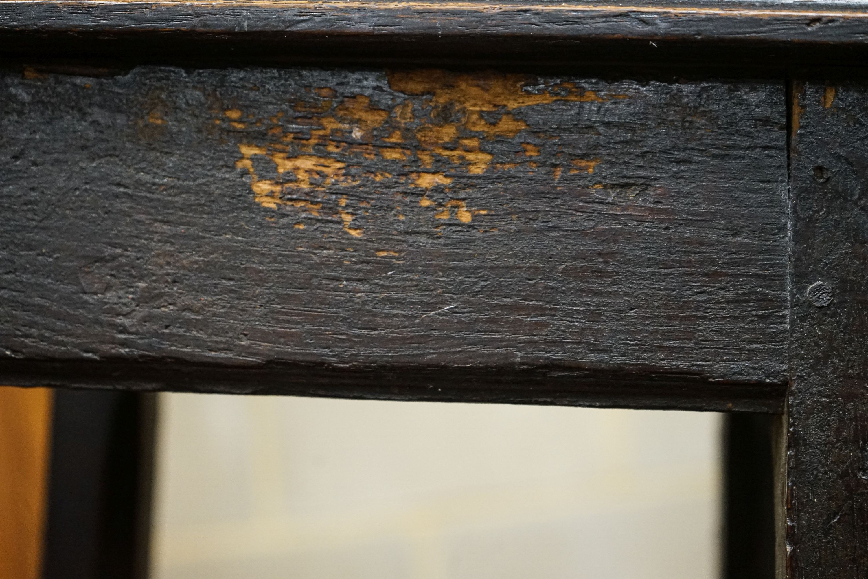 An 18th century primitive oak stool, width 34cm, depth 26cm, height 48cm and an Anglo Indian child's chair, width 31cm